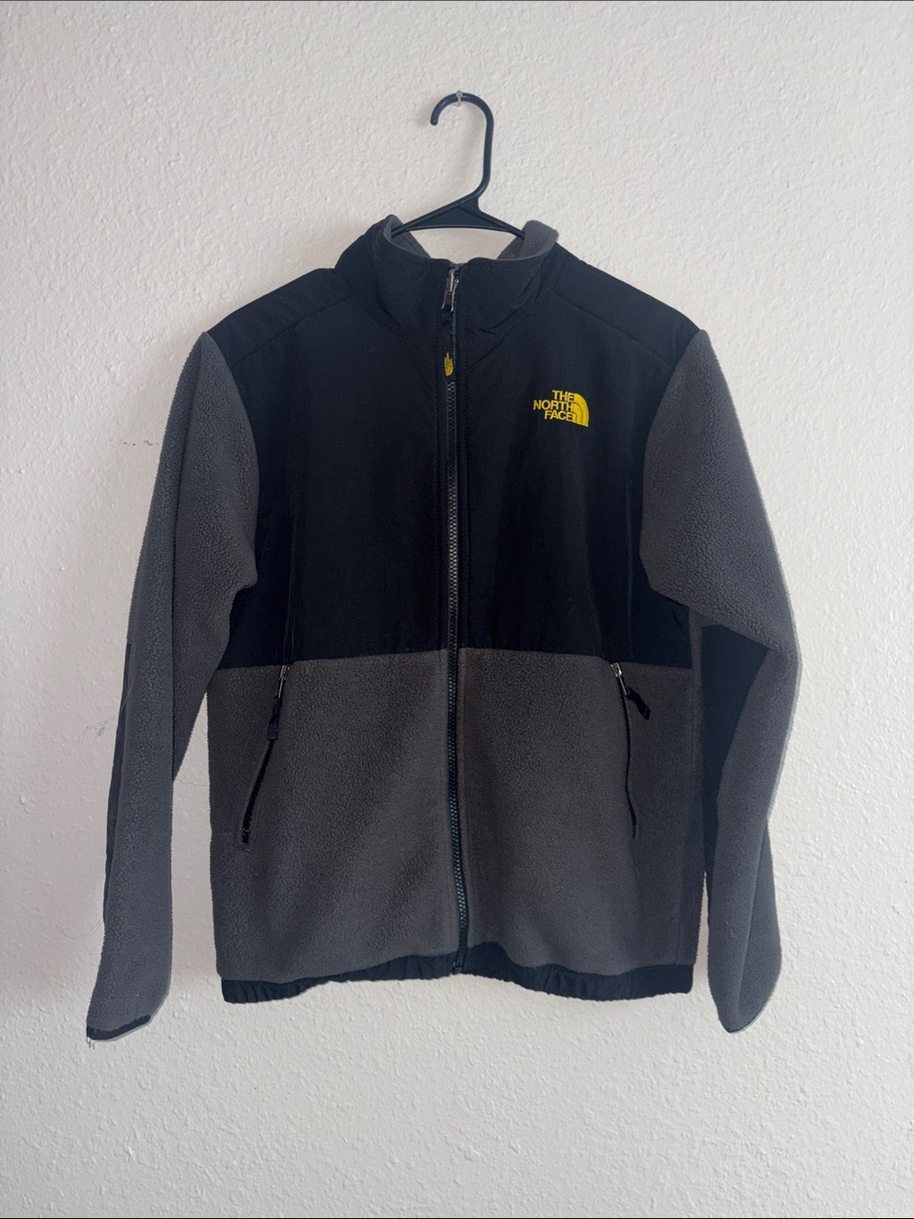 The North Face Black Jacket with Yellow Embroidered Logo
